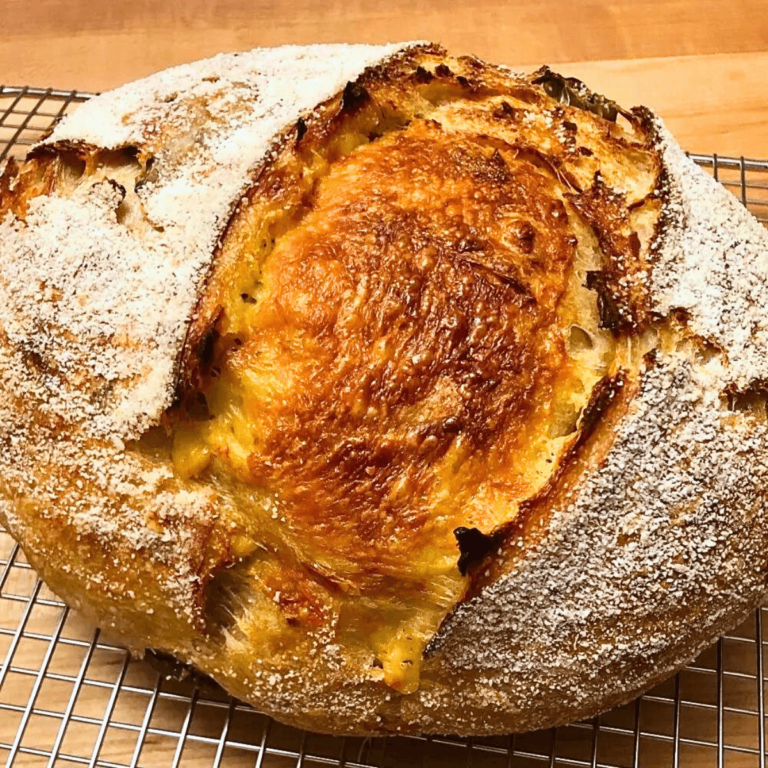 Jalapeño Cheddar Sourdough Bread on a wire cooling rack