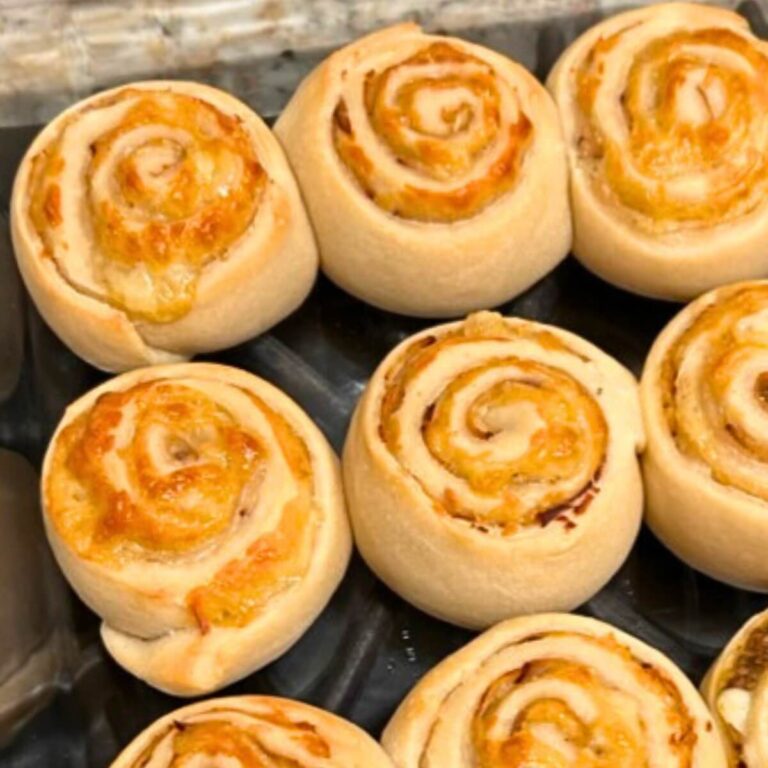 Sourdough turkey and cheese pinwheels in glass baking dish