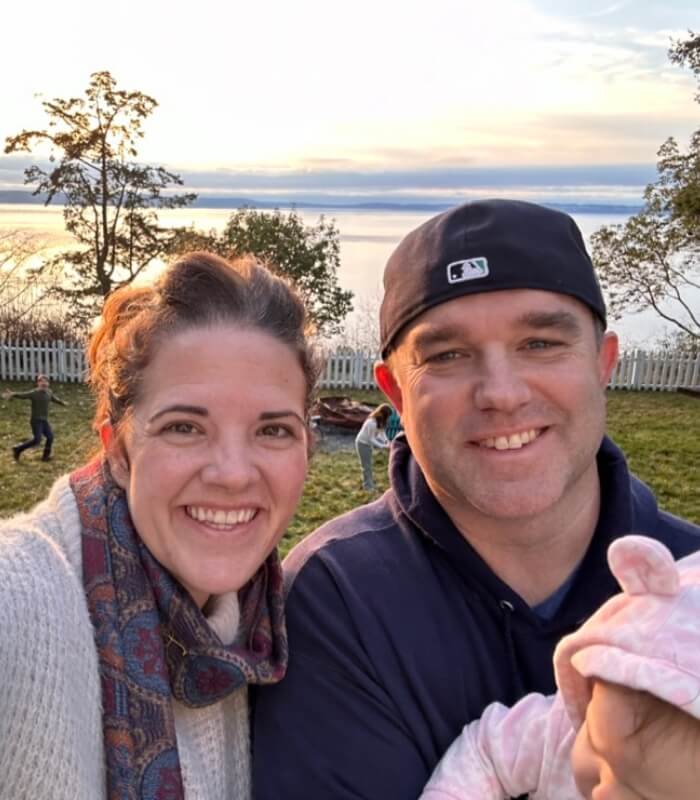 Jenny and husband with kids in background