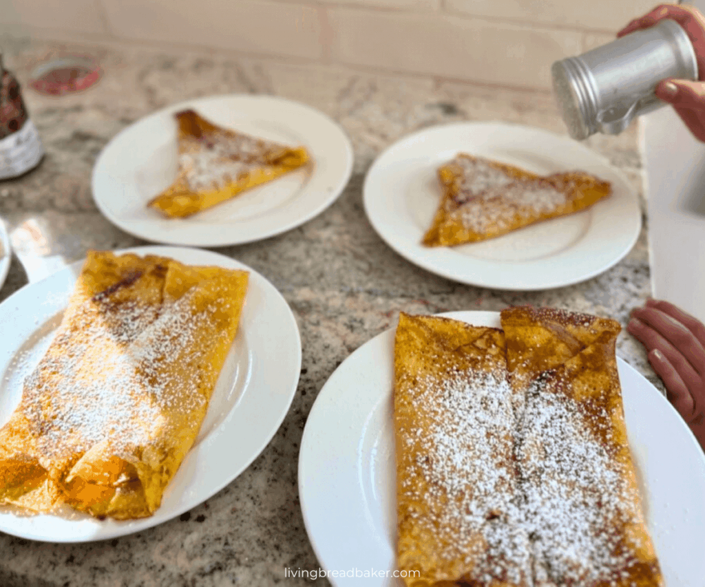 Easy Sourdough Discard Crepes Recipe blog image powdered sugar dusting 